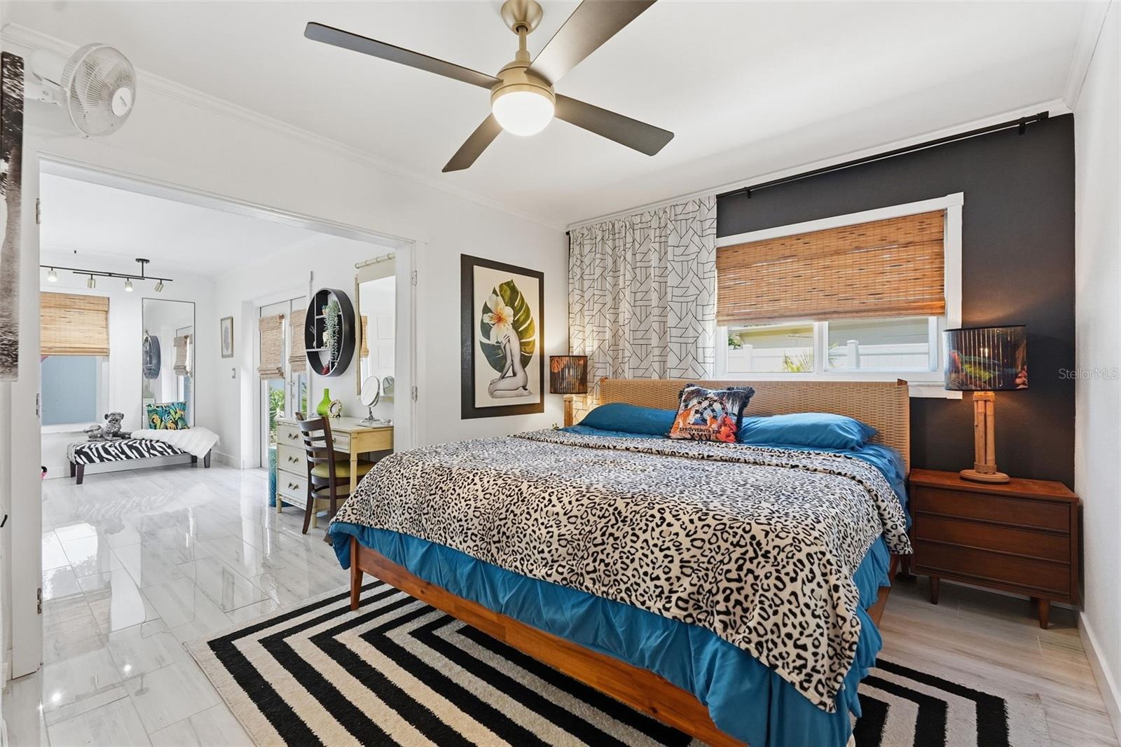 The oversized owner’s suite features an en suite bath, walk-in cedar closet, and expanded flex space perfect for a lounge, office, dressing room, or private retreat.