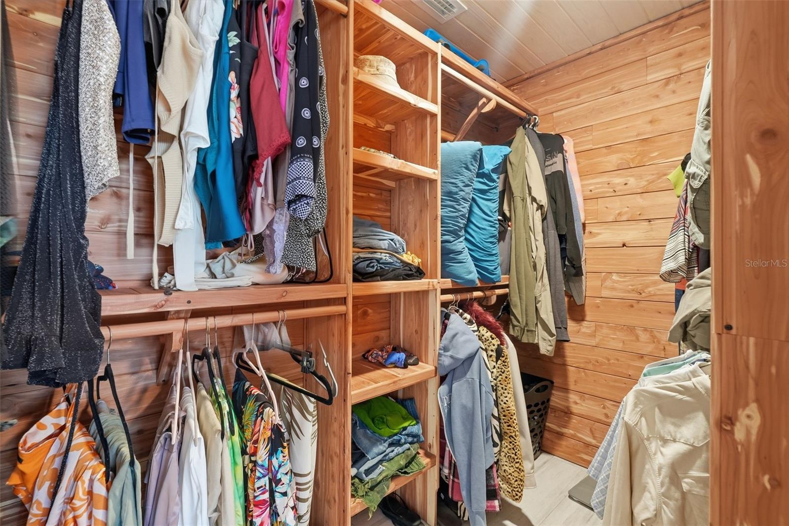 The oversized owner’s suite features an en suite bath, walk-in cedar closet, and expanded flex space perfect for a lounge, office, dressing room, or private retreat.