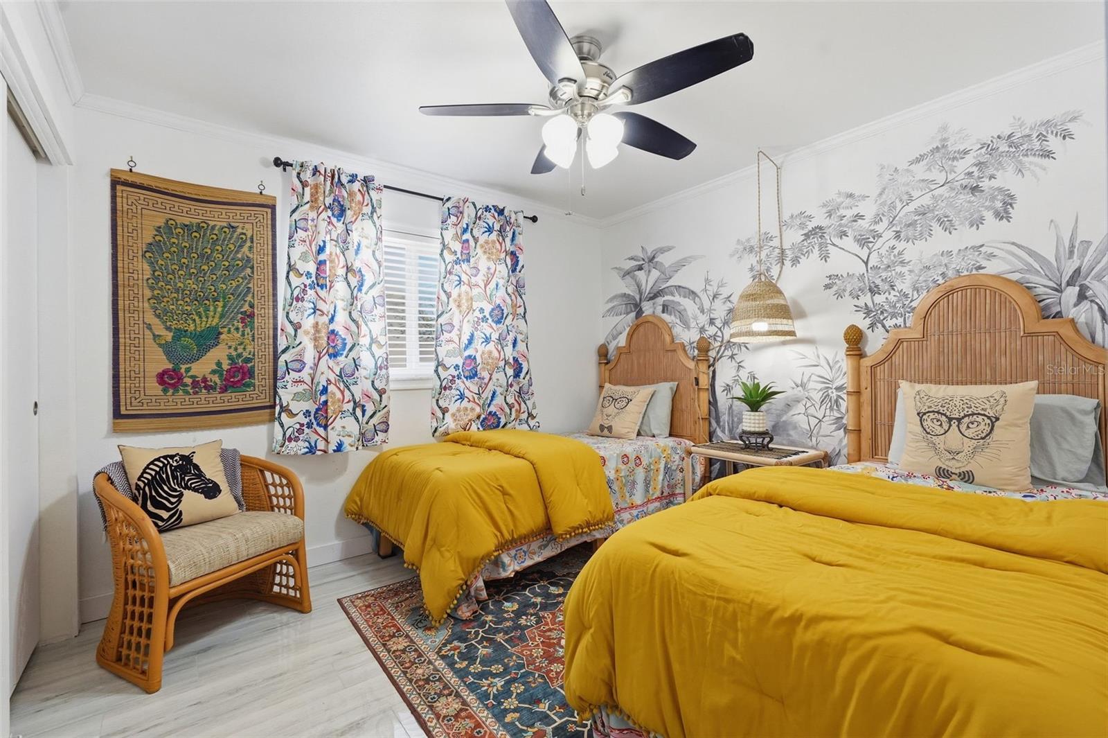 Two sizable guest bedrooms and a full bathroom are tucked away on the opposite side of the home for added privacy.