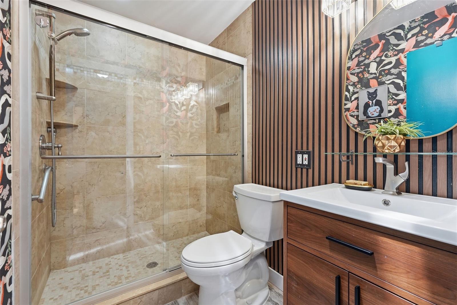 Two sizable guest bedrooms and a full bathroom are tucked away on the opposite side of the home for added privacy.