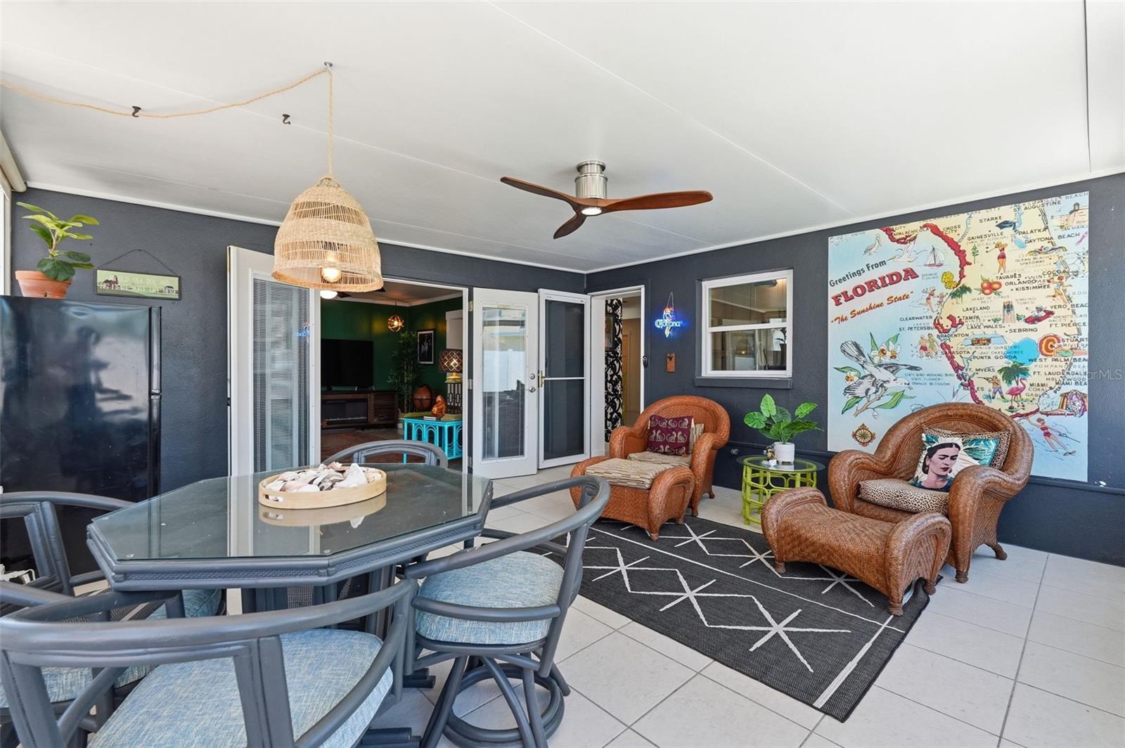 The screened patio offers the perfect bonus hangout space with sliding windows, room to lounge or dine, and even a mini fridge for easy entertaining.
