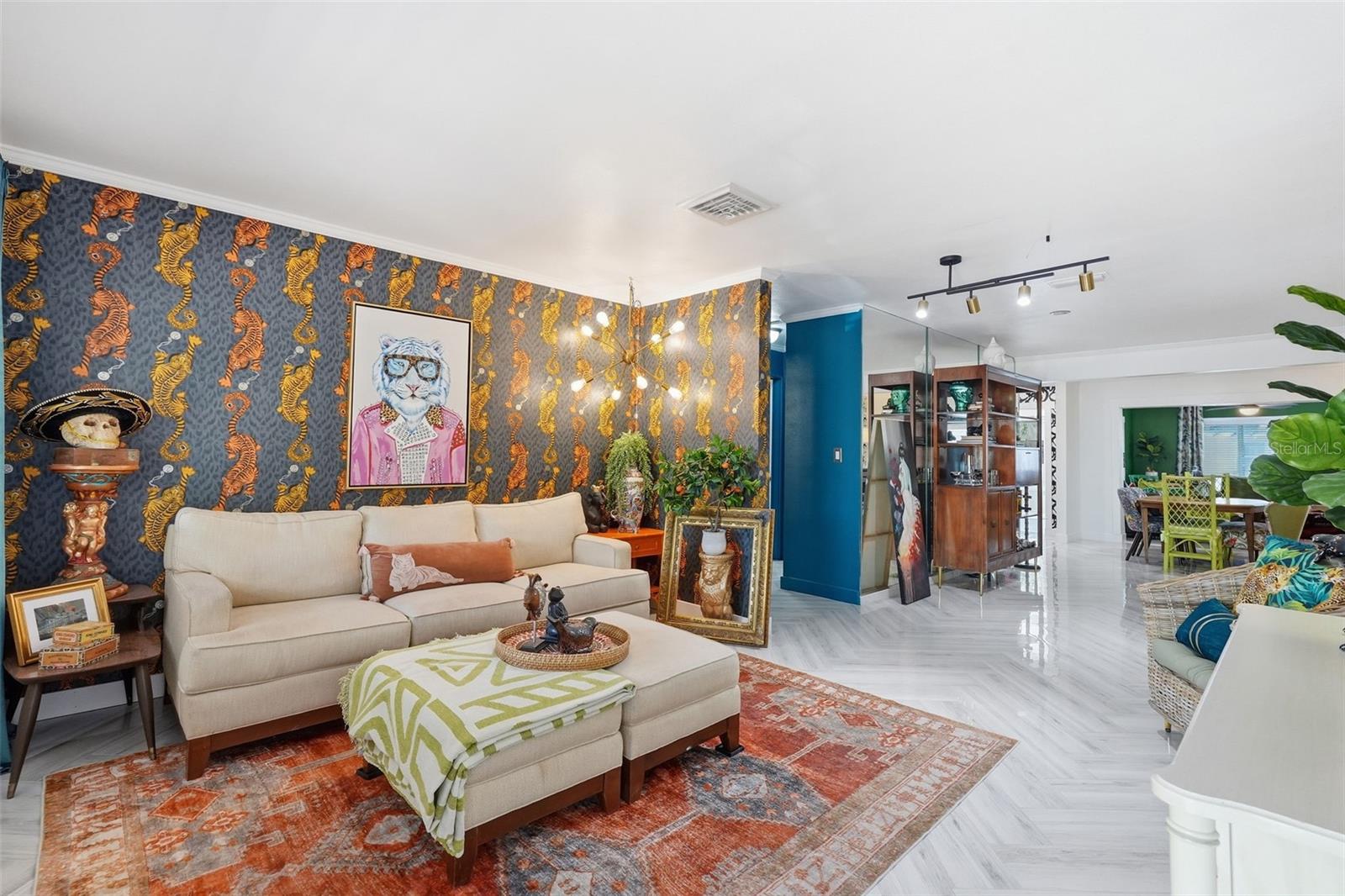 Designer wallpaper, curated lighting, and bold artistic flair set the tone from the moment you walk in.