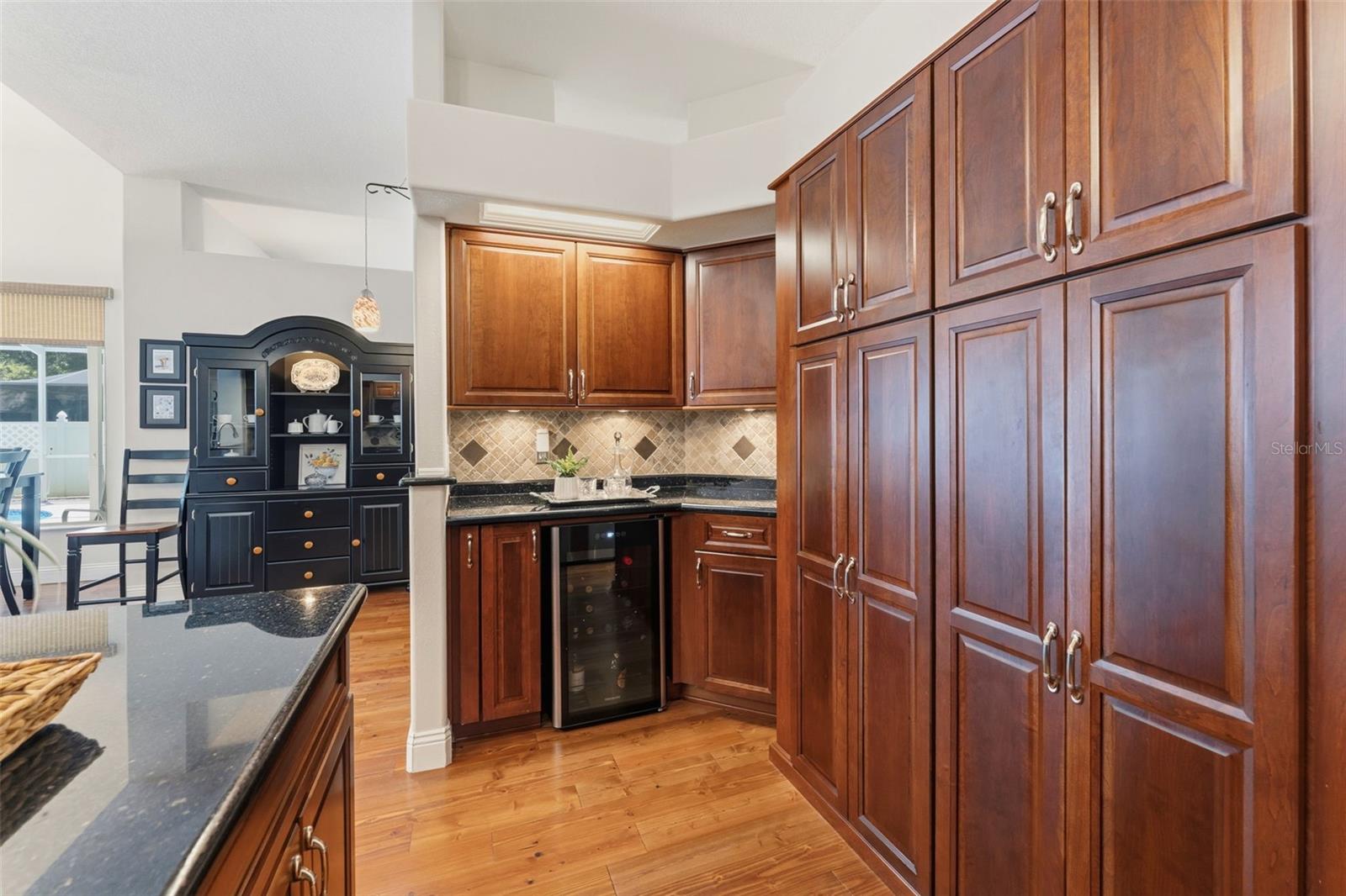 Wine refrigerator and butler's pantry area