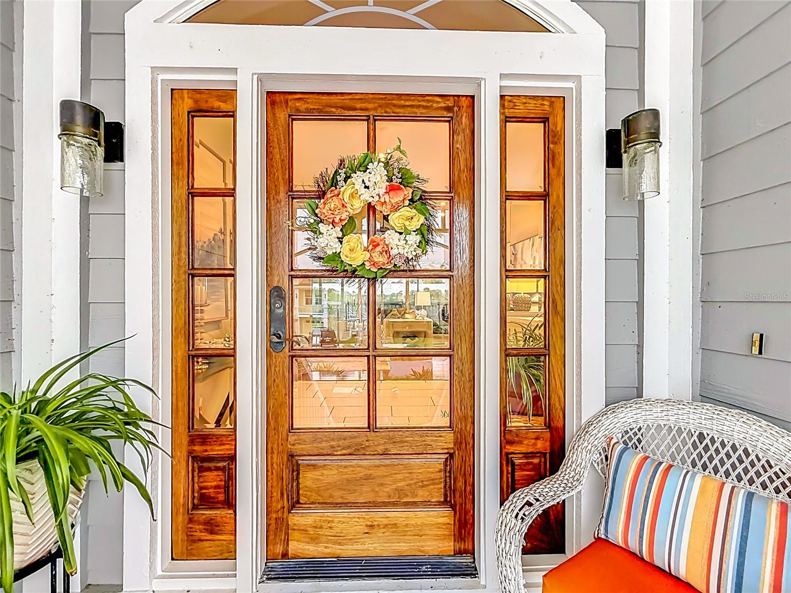 Step through this classic and inviting front door, welcoming you to a vibrant lifestyle of intercoastal waterfront living—where every entry feels like a warm embrace and endless adventures await.