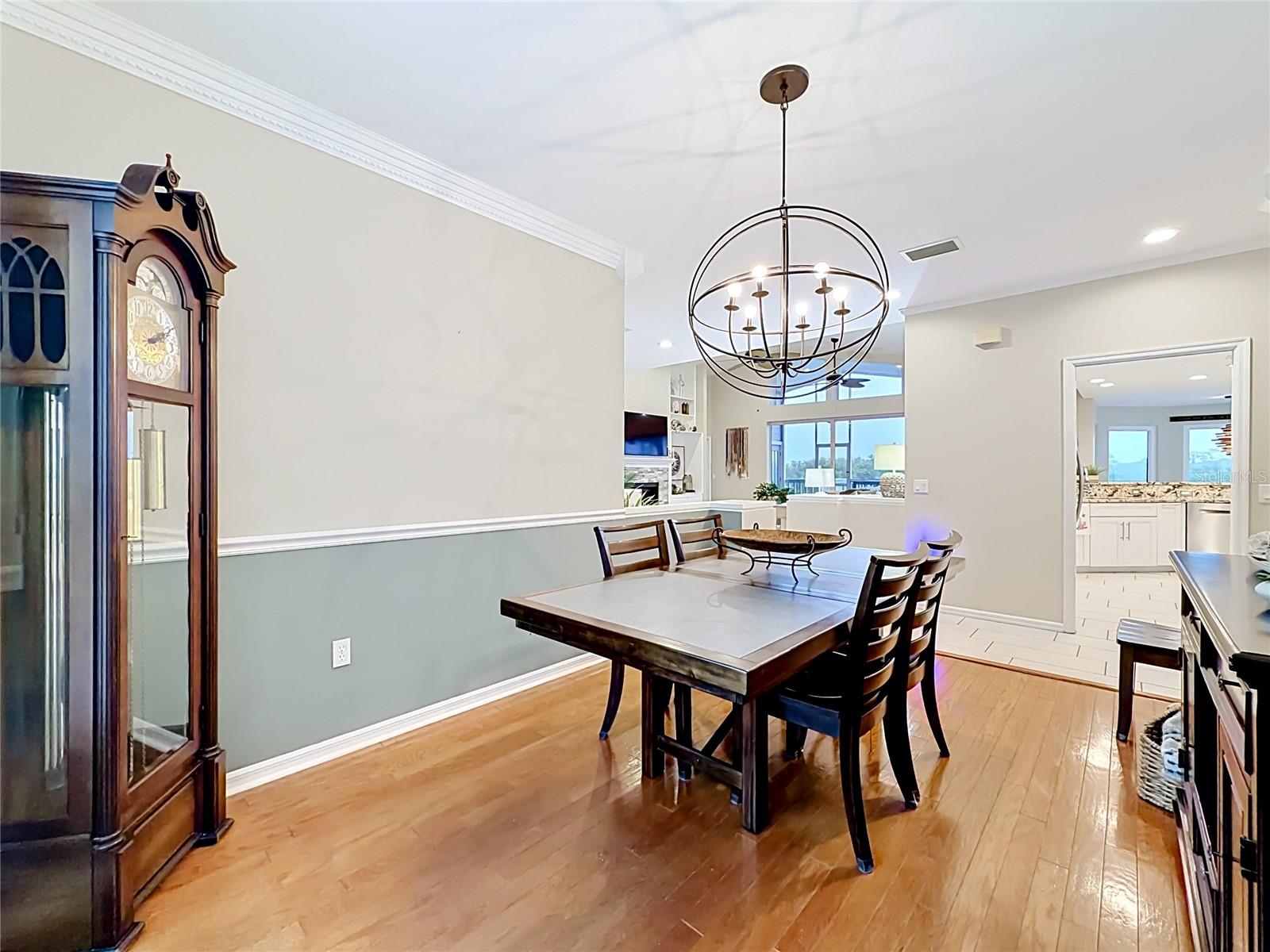 Bright and airy dining room flooded with natural sunlight, ideally situated between the great room and kitchen.