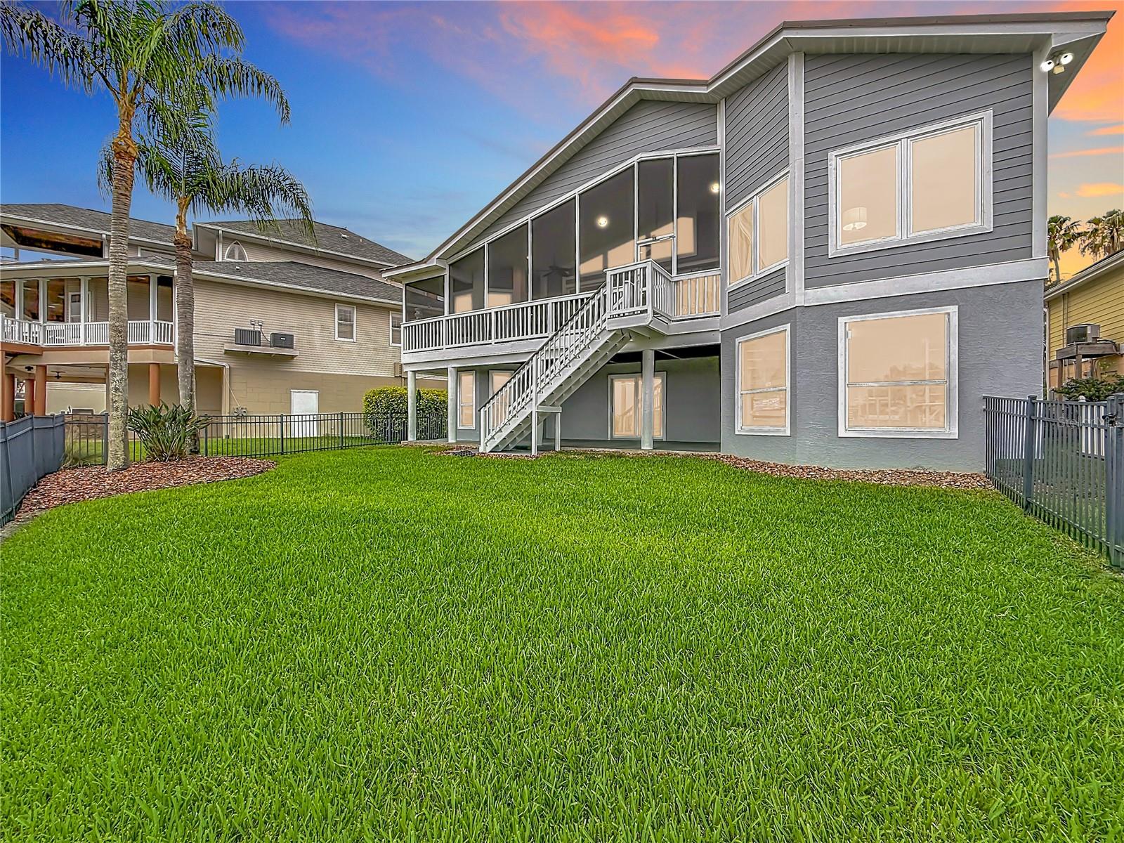 Discover the spacious backyard, a unique haven nestled against the tranquil waterway. This serene setting invites you to create unforgettable memories amid nature’s beauty—a perfect canvas for gatherings, relaxation, and one-of-a-kind experiences.