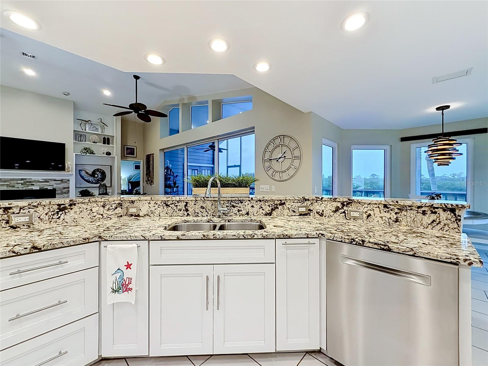 This gorgeous kitchen delights with its fresh white aesthetic and shimmering quartz countertops.