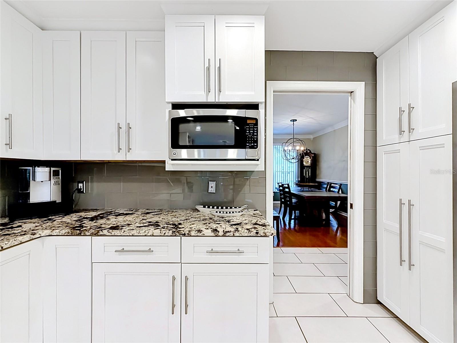 This kitchen marries beauty and practicality perfectly, boasting abundant storage for all your culinary needs