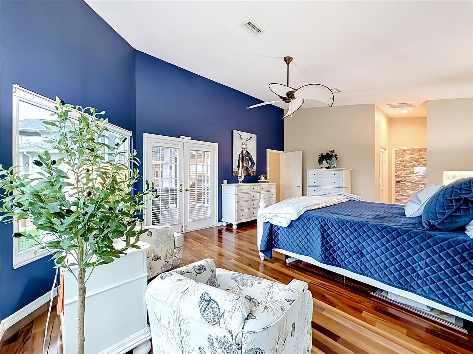 This primary bedroom is a true sanctuary, combining freshly painted tranquility with spectacular intercoastal views, inviting you to embrace the beauty of waterfront living.