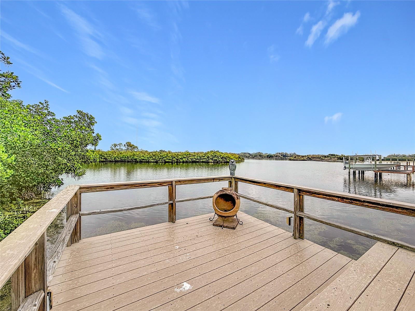 Welcome to your own slice of paradise—a charming dock that beckons you to unwind and embrace the tranquility of nature. Picture yourself here, reflecting on the day, as gentle waves lap against the shore; it's the perfect oasis to soothe your soul and reconnect with the simple joys of life.