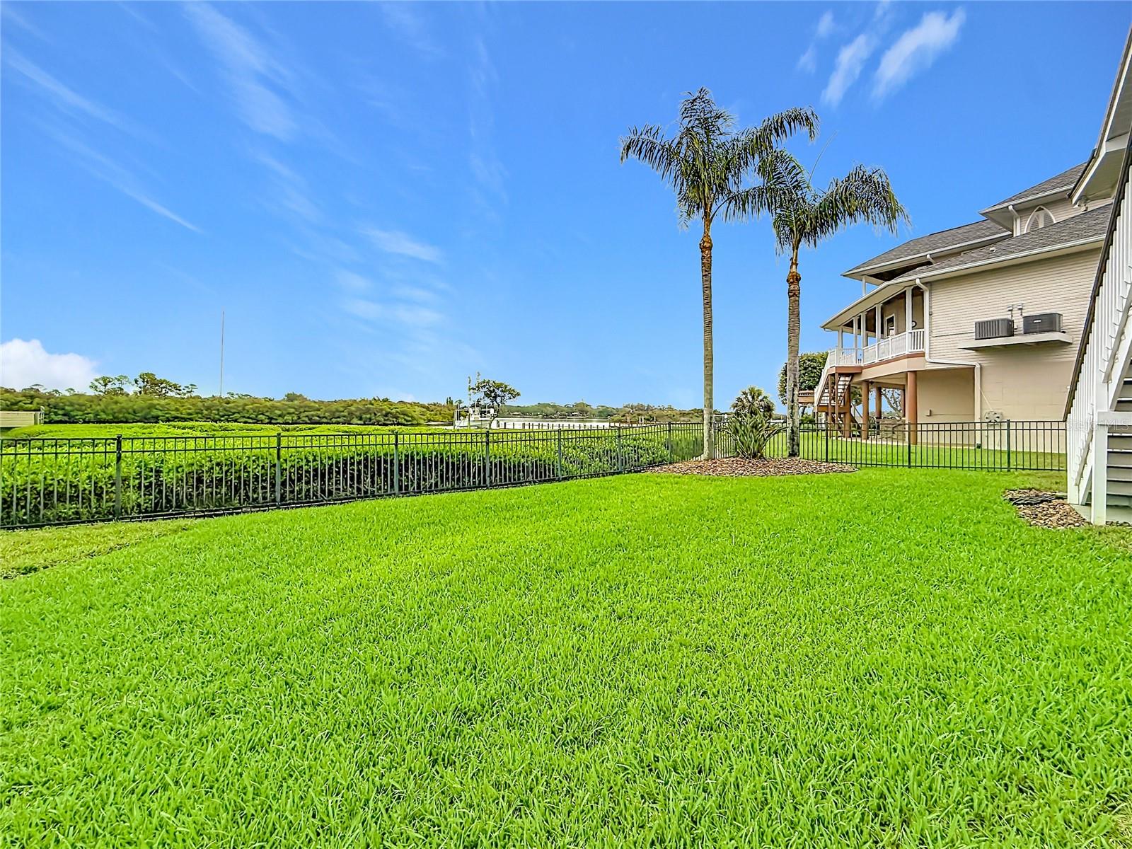 Imagine your dream oasis in this backyard, where a stunning patio and pool await, all framed by the picturesque intercoastal backdrop—perfect for relaxing, entertaining, and making unforgettable memories.