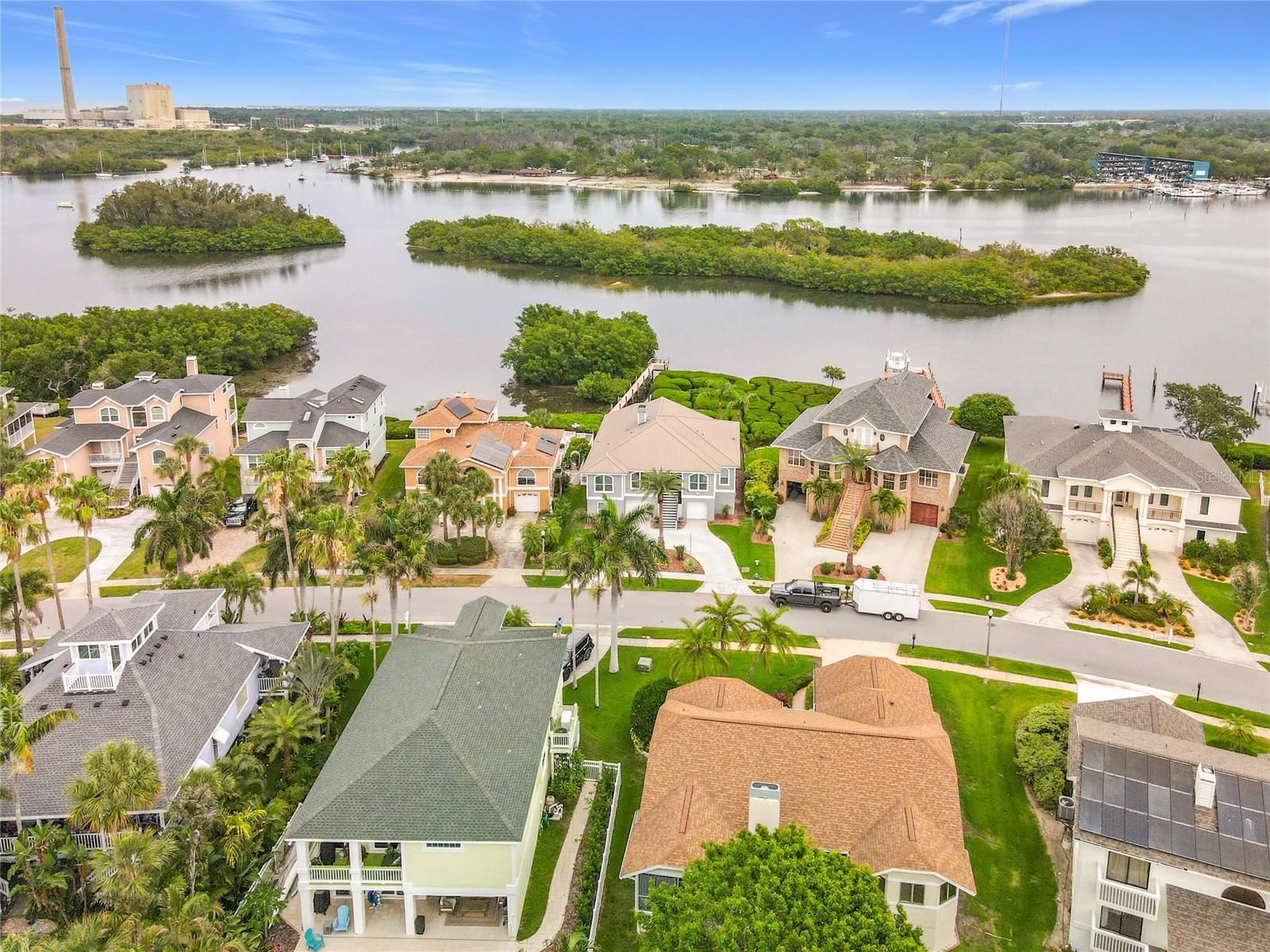 Elevated above the shimmering intercoastal, this breathtaking aerial view captures the essence of coastal charm—where tranquil waters meet lush landscapes, inviting you to immerse yourself in the beauty and serenity of waterfront living