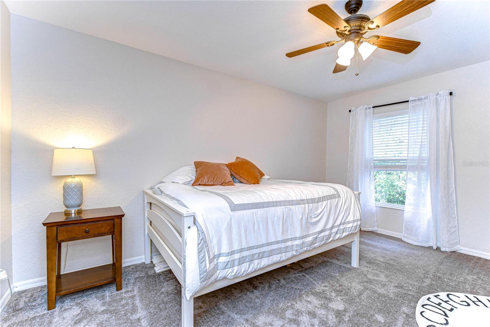 Generously sized secondary bedroom with walk-in closet.