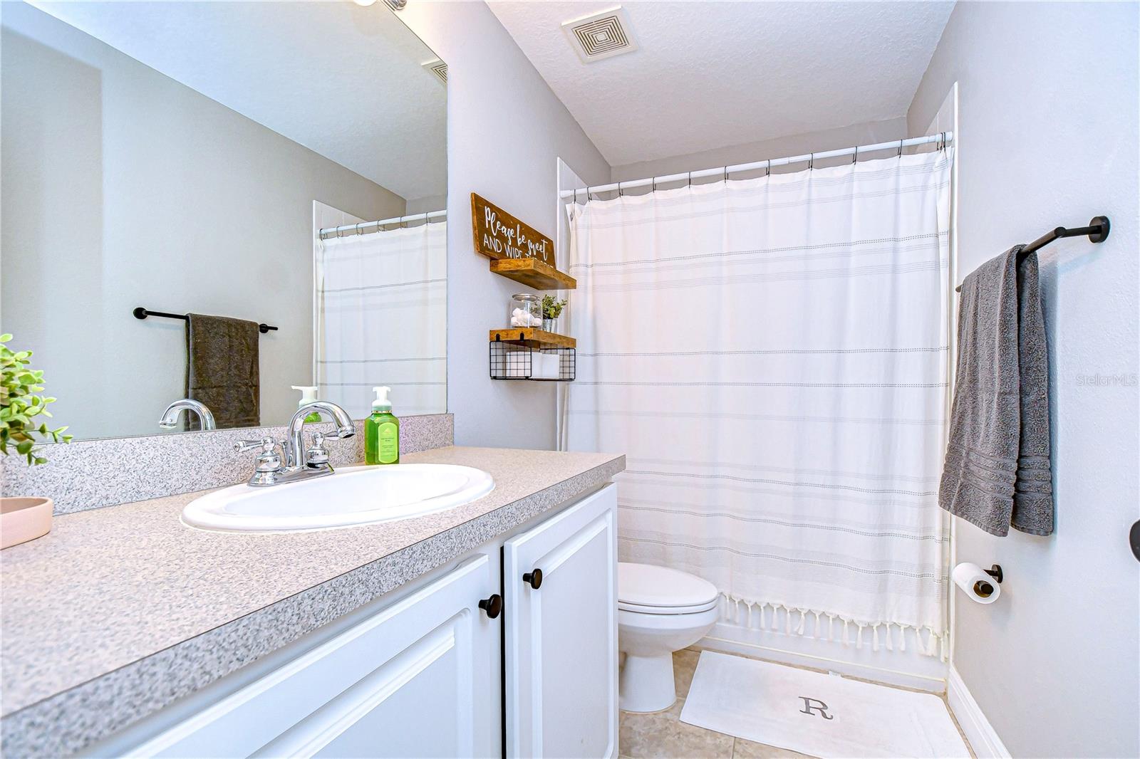 Well-maintained full bathroom serving secondary bedrooms.