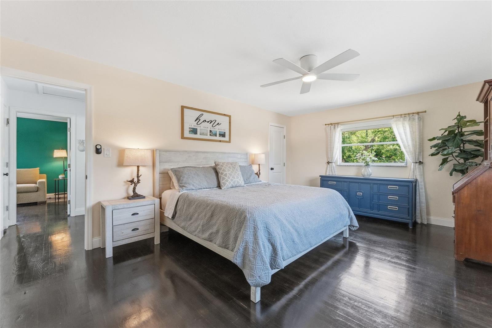 Re-finished wood floors and tons of natural light in your large primary suite