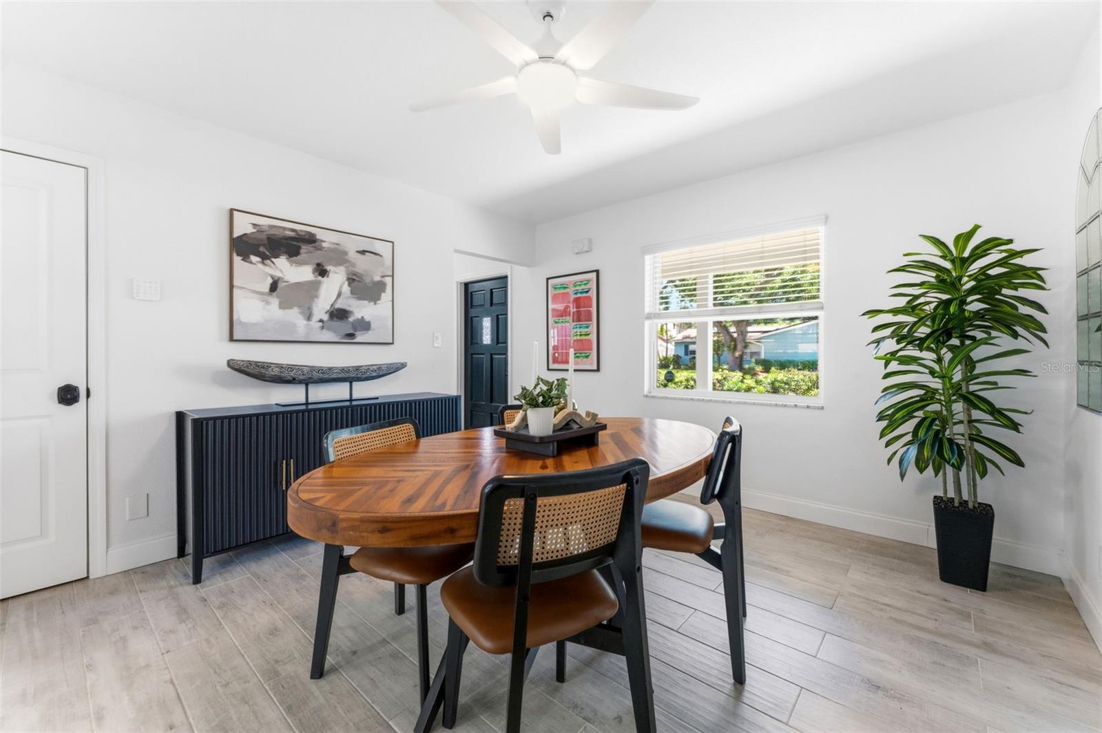 Bright and large rooms set off by wood-look tile in a classic shade.