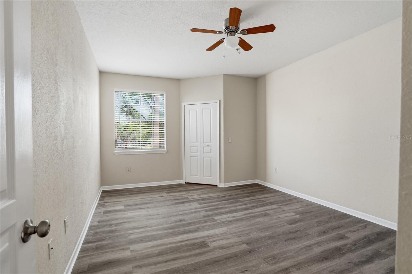 Primary Bedroom w/ en-suite bath and walk in closet, new lux vinyl flooring