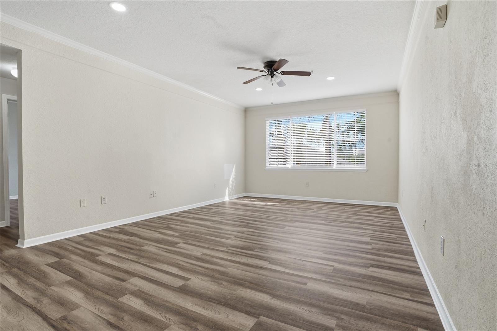 Large Great Room w/ big windows for natural light, new lux vinyl flooring and fresh paint