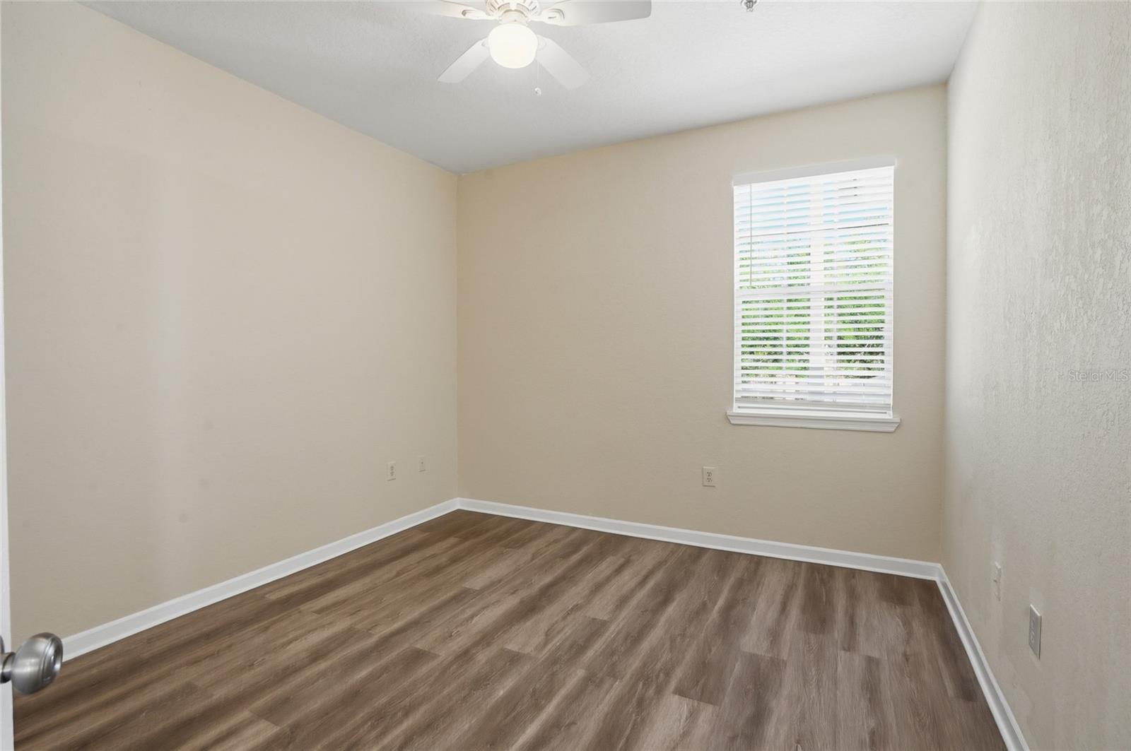 Secondary Bedroom, great size w/ new flooring, ceiling fan
