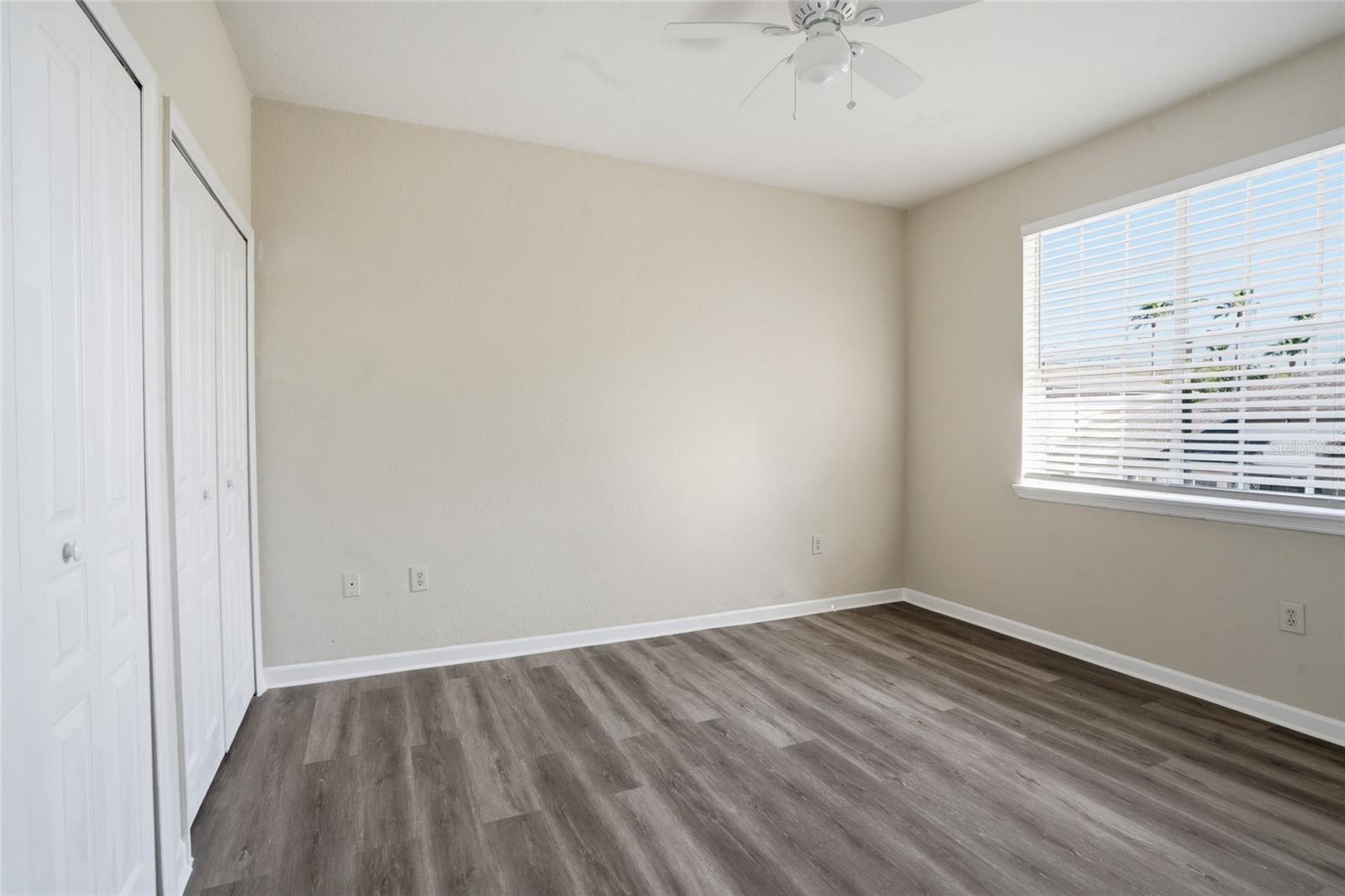 Bedroom 3 w/ new lux vinyl flooring, ceiling fan