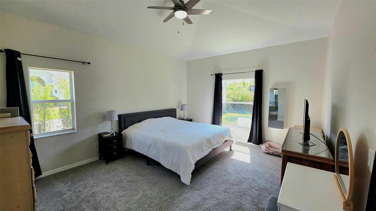 Primary Bedroom with view of Backyard