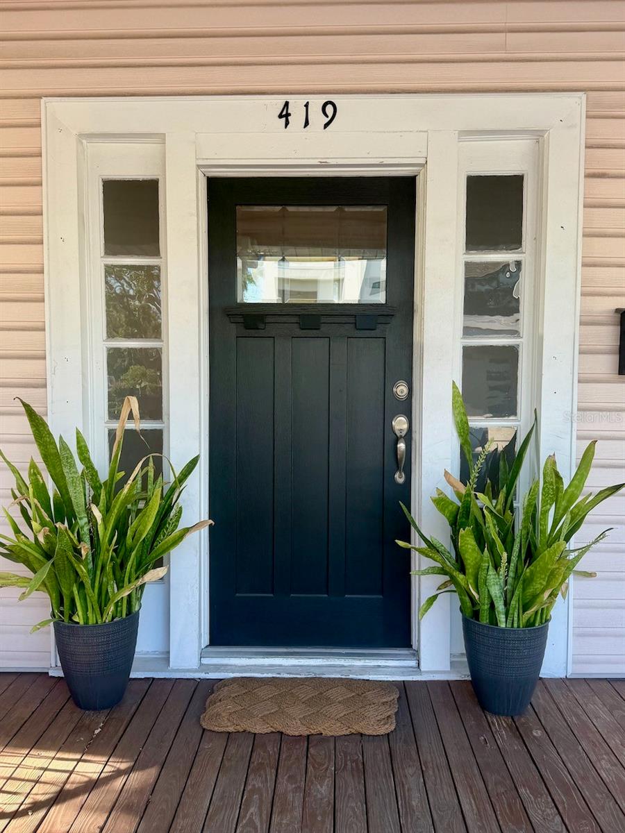 Front door on the massive front porch