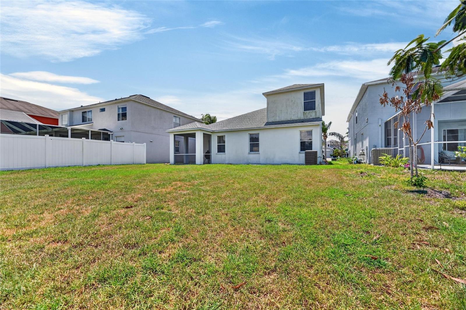 Large backyard and back view of home