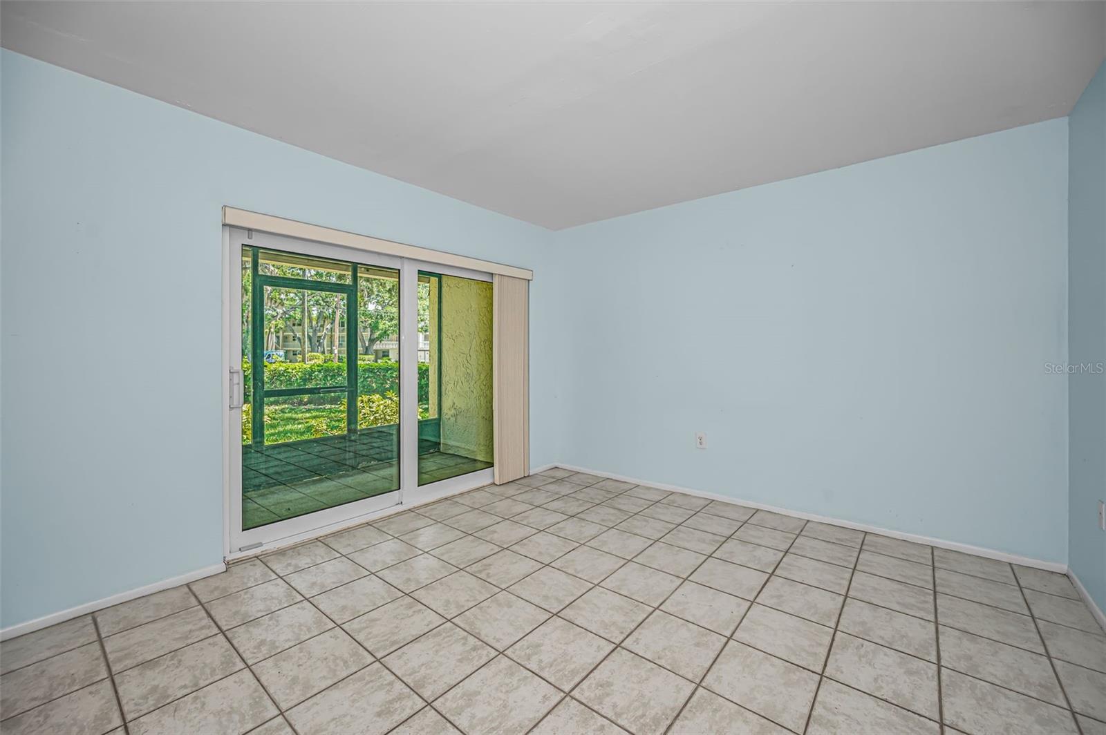 Bedroom 2 with Impact sliders going to the private lanai