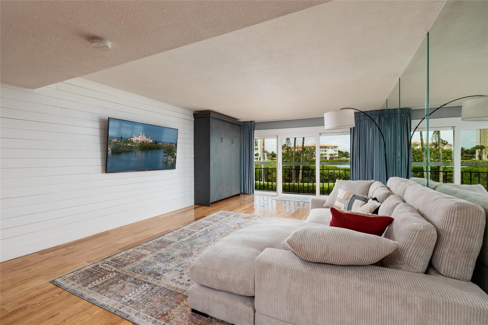 Entertainment area of living room with 70' wall mounted TV