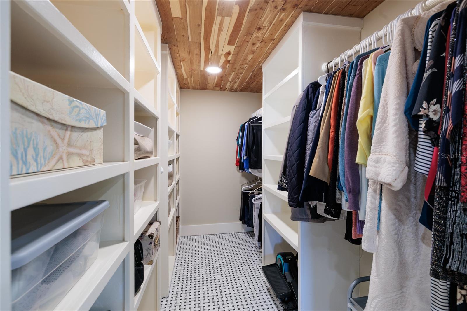 Large walk in closet with rod space and shelving for lots of storage