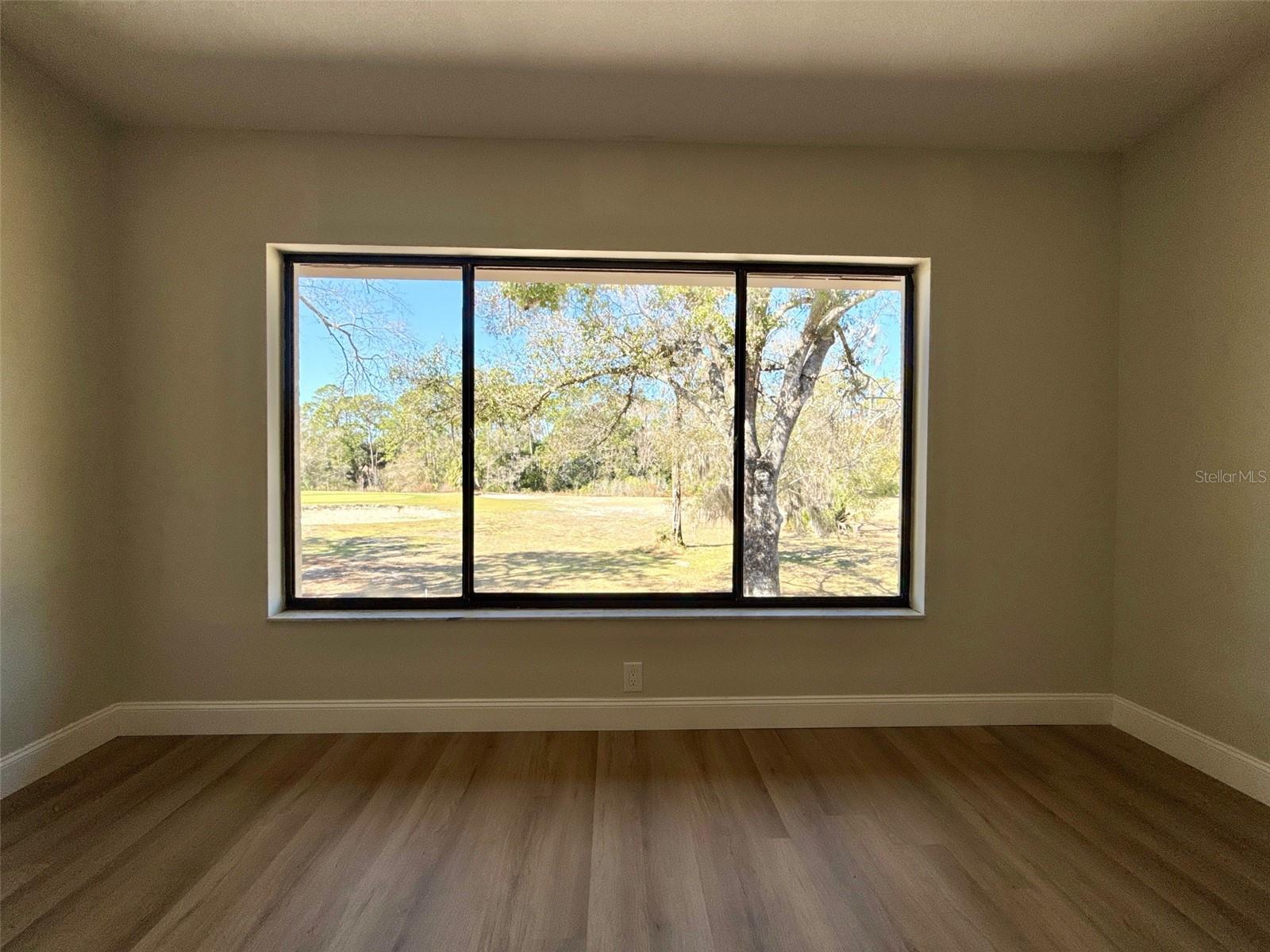 Window of Great room with sunset views, wildlife and golfcourse