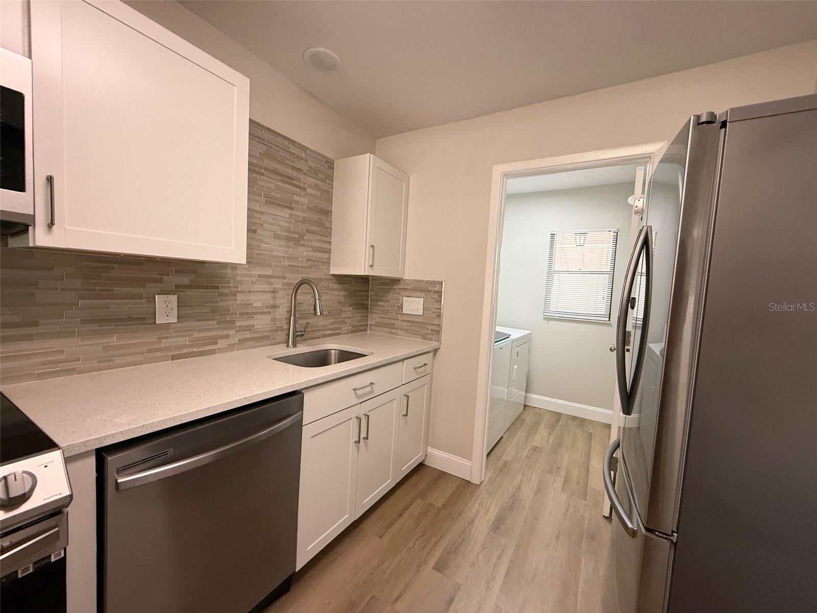 Kitchen leading to laundry room