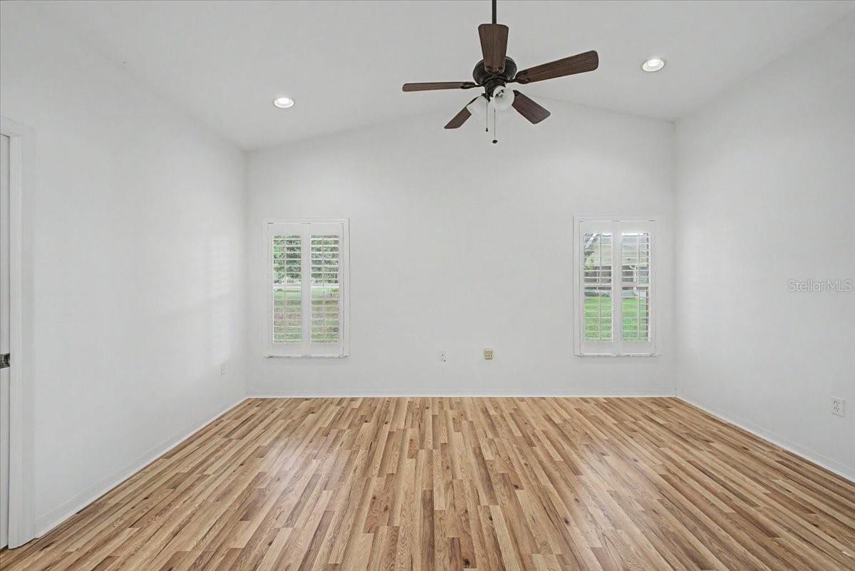 Primary Bedroom with Vaulted Ceilings and Plantation Shutters