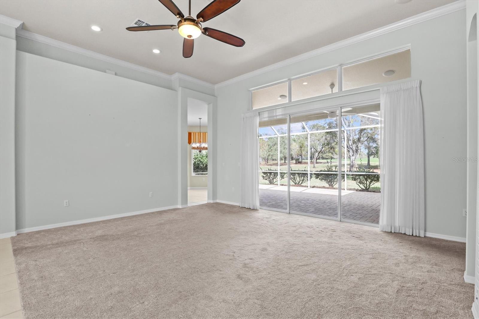 Living Room with Sliders to Screened Enclosure
