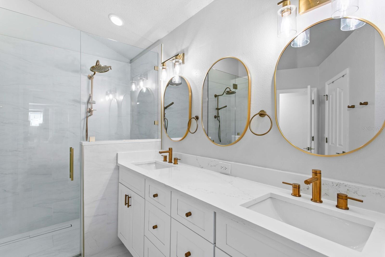 The elegant primary bath perfectly compliments the designer kitchen