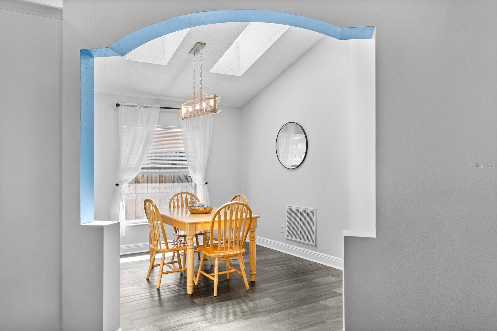 Decorative niche frames the formal dining room