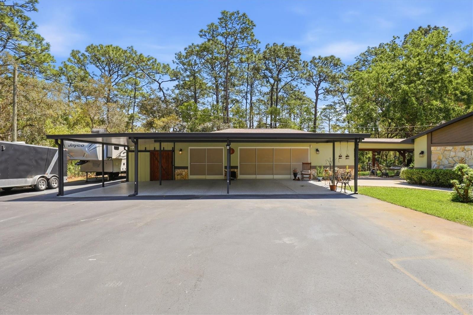 3 Car Garage, 4 Car Carport and RV Parking with 50 amp Plug
