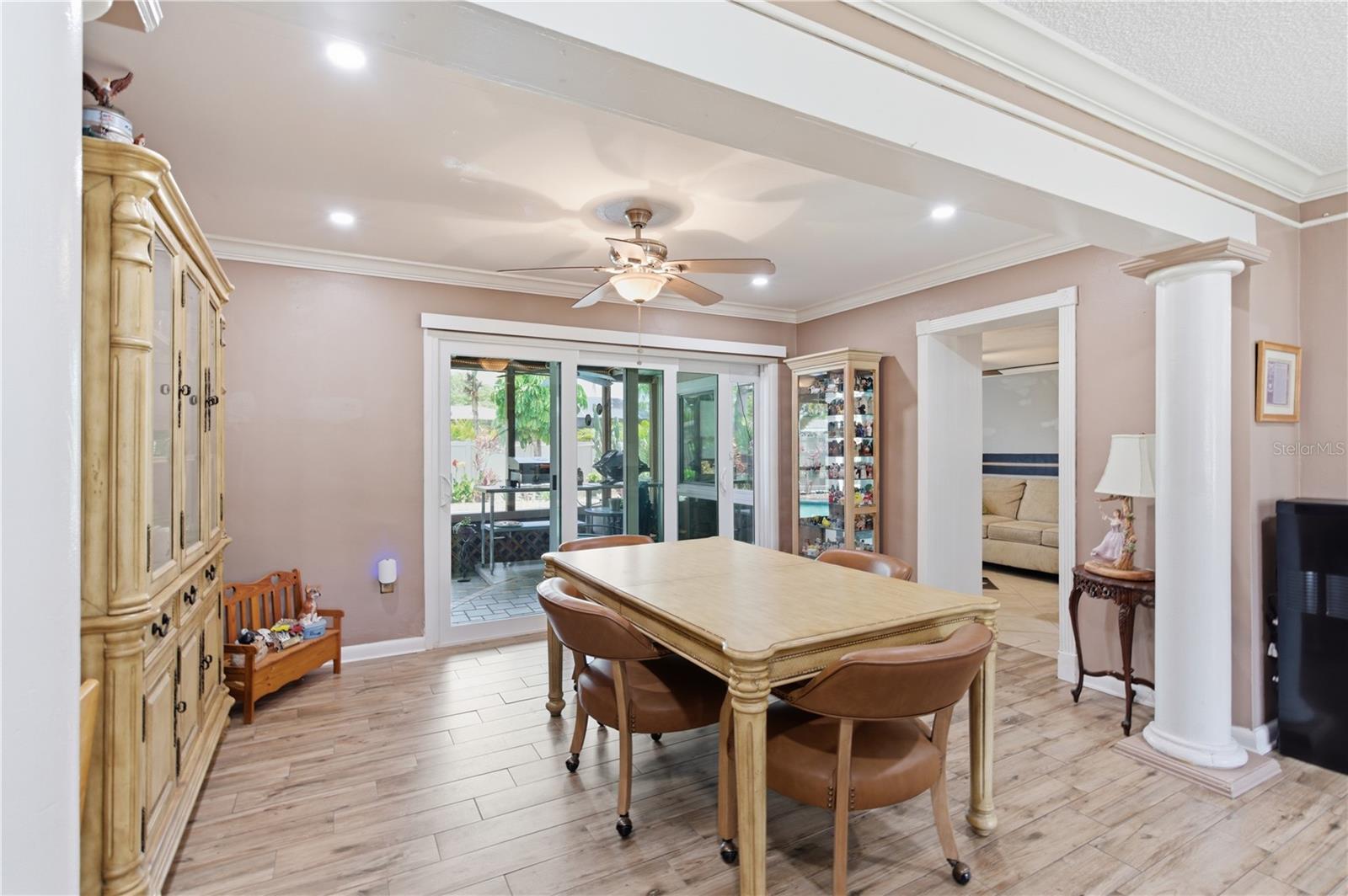 Dining room looking into lanai and bonus room