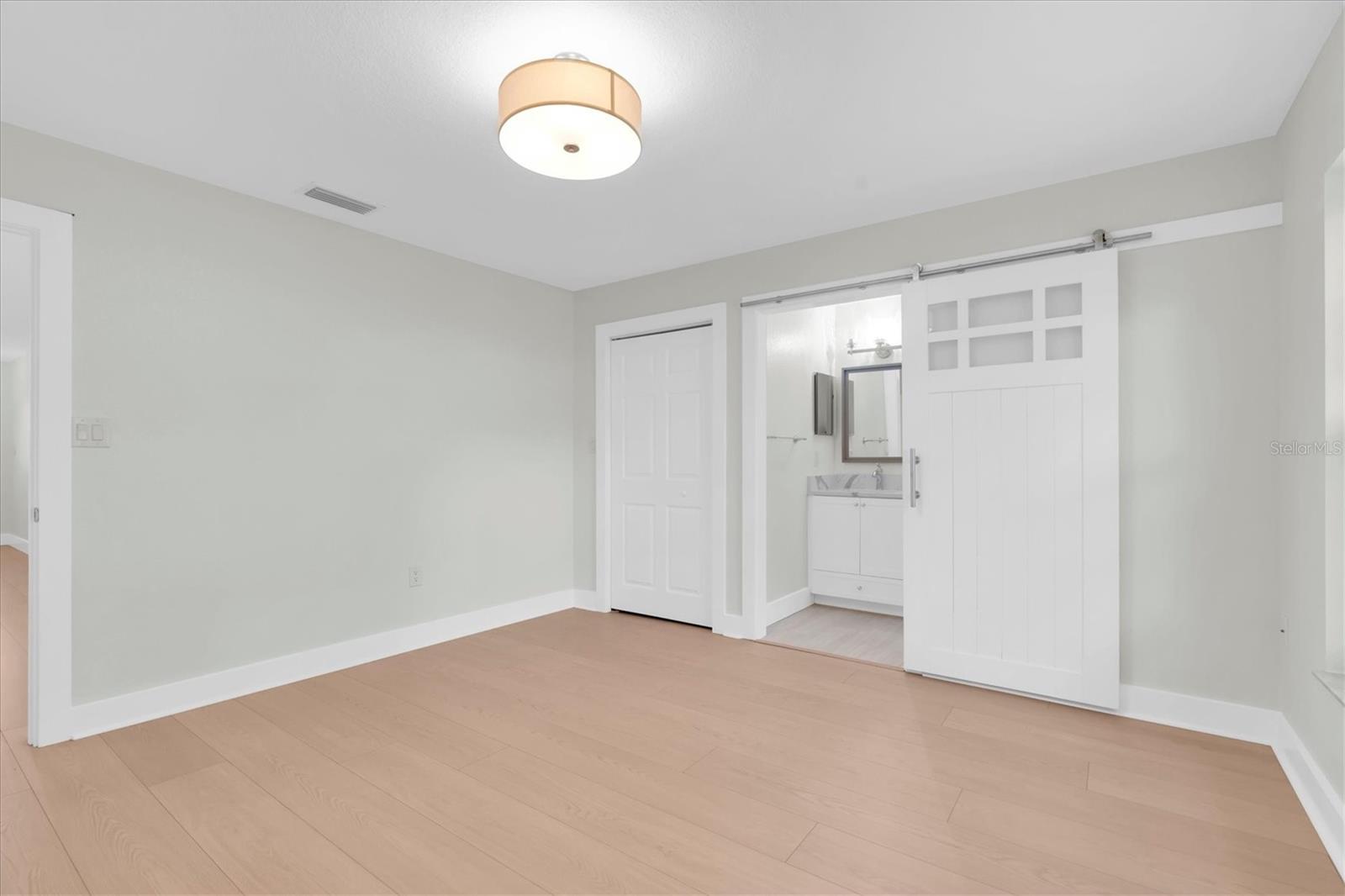 Barn door to bathroom.