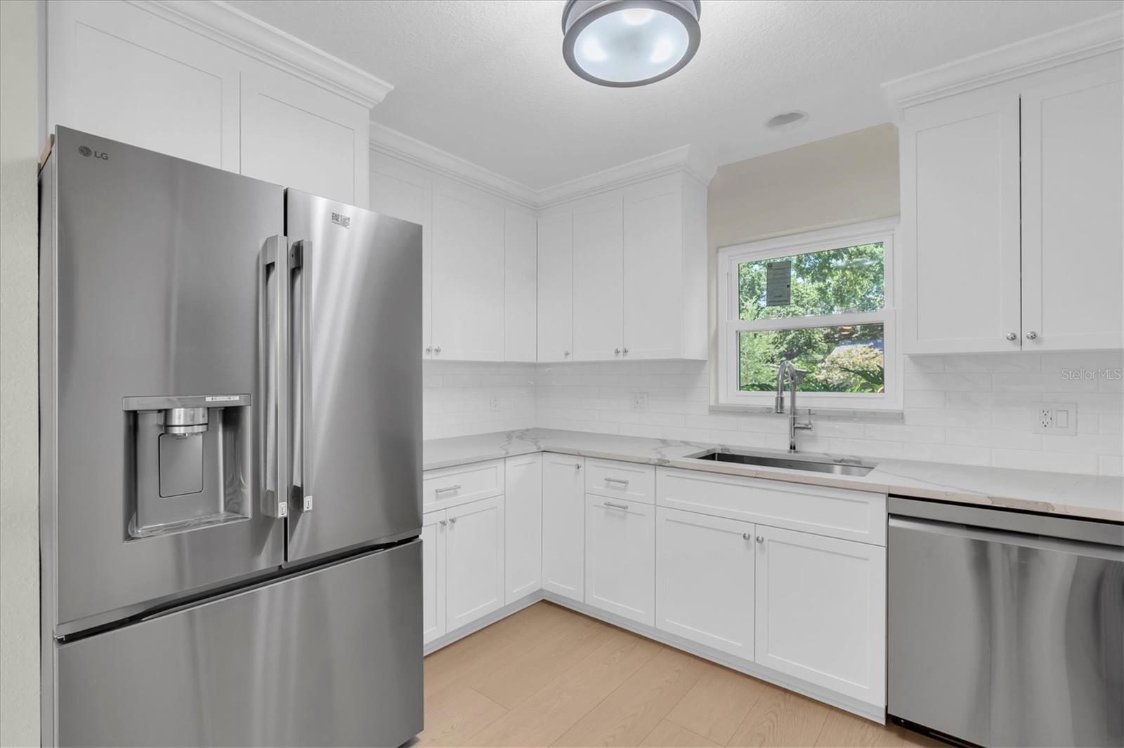 Light and bright kitchen with window over sink.