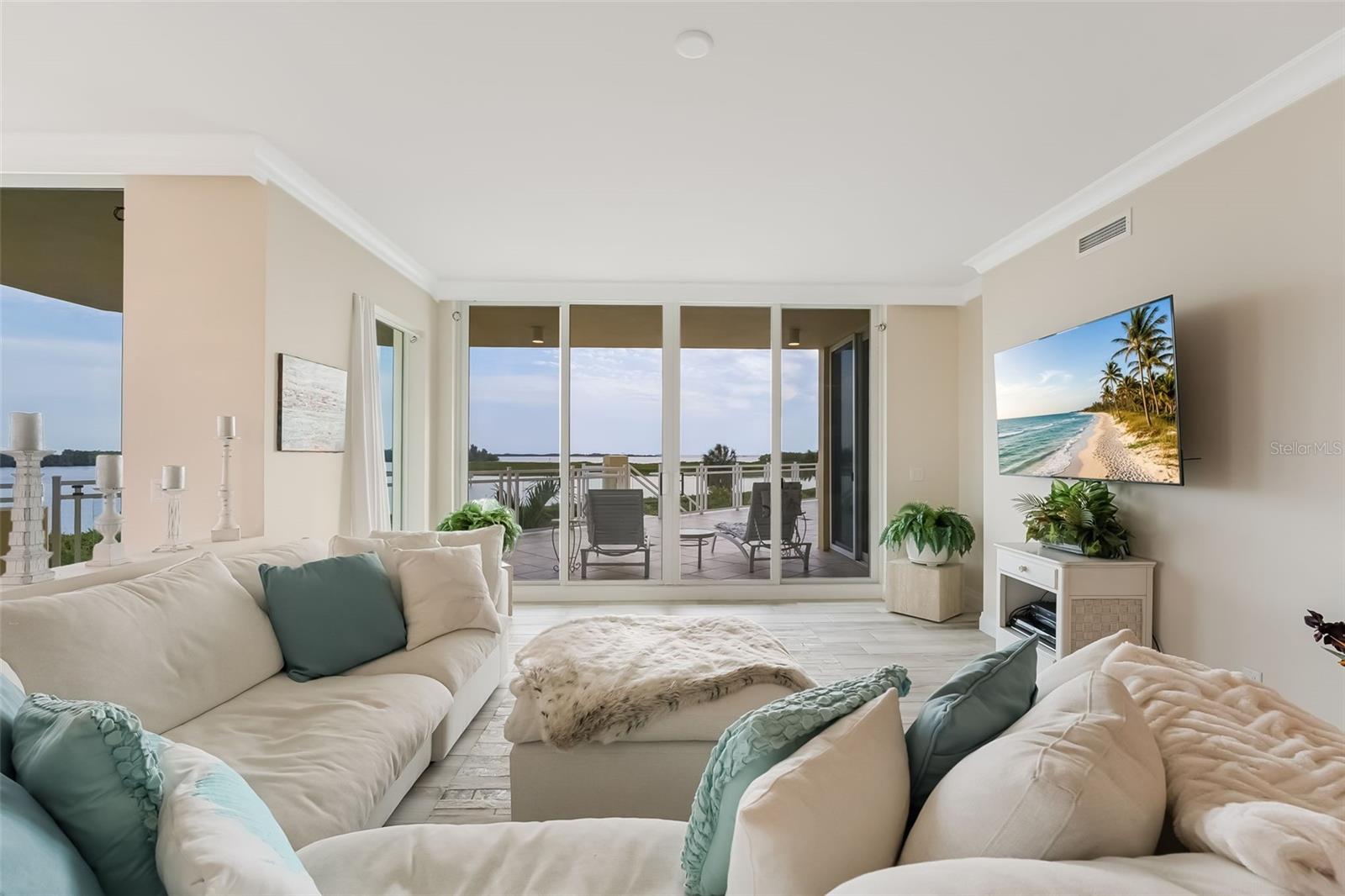 This is your magnificent view from the living room overlooking the balcony and the water