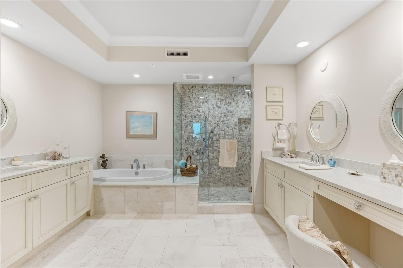 This is the primary bathroom with a separate water closest and separate vanities