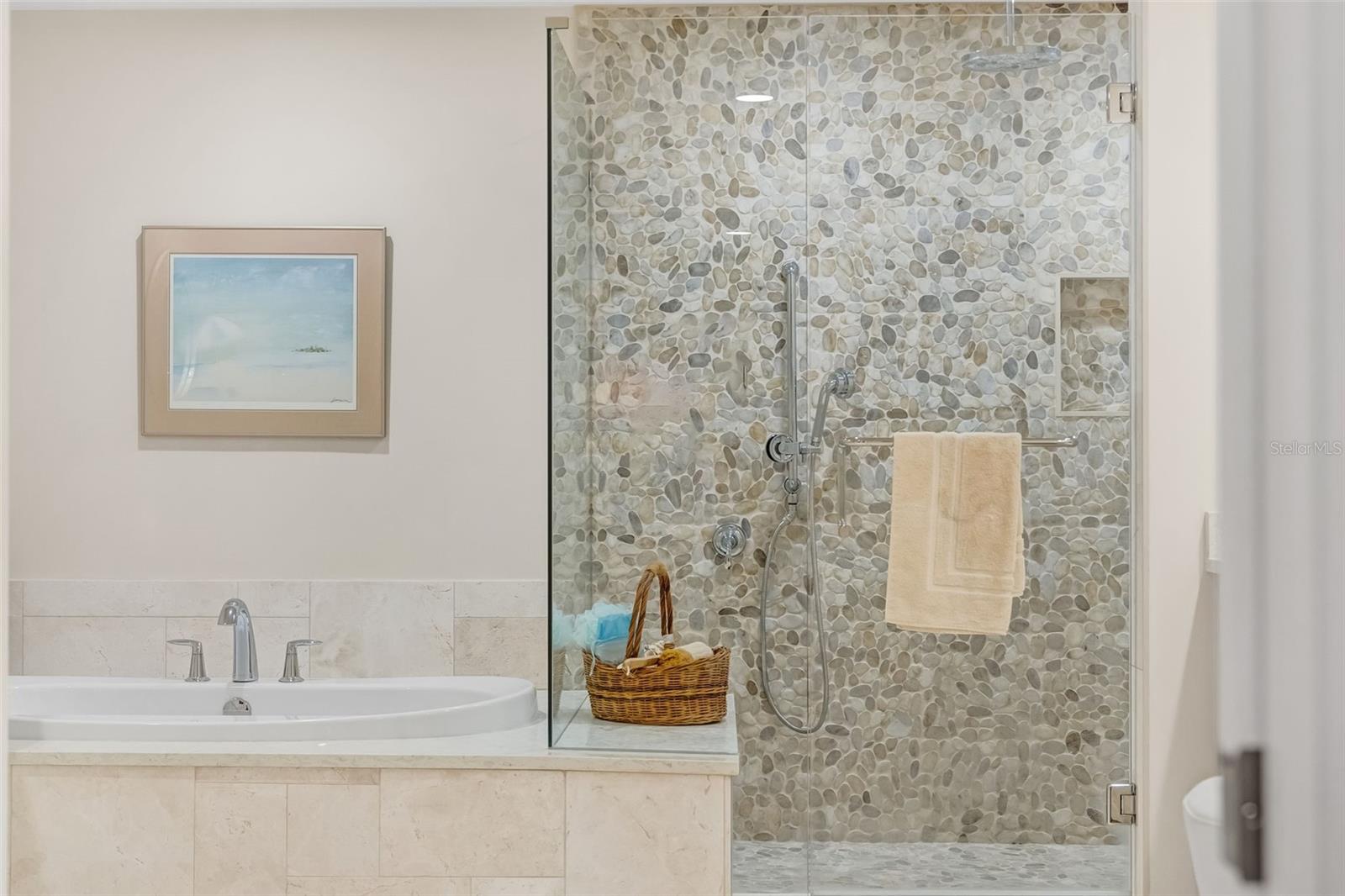 The primary bathroom has a separate tub and a walk-in shower.