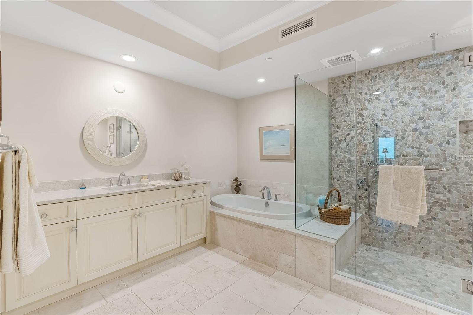 The primary bathroom offers ample countertop space.