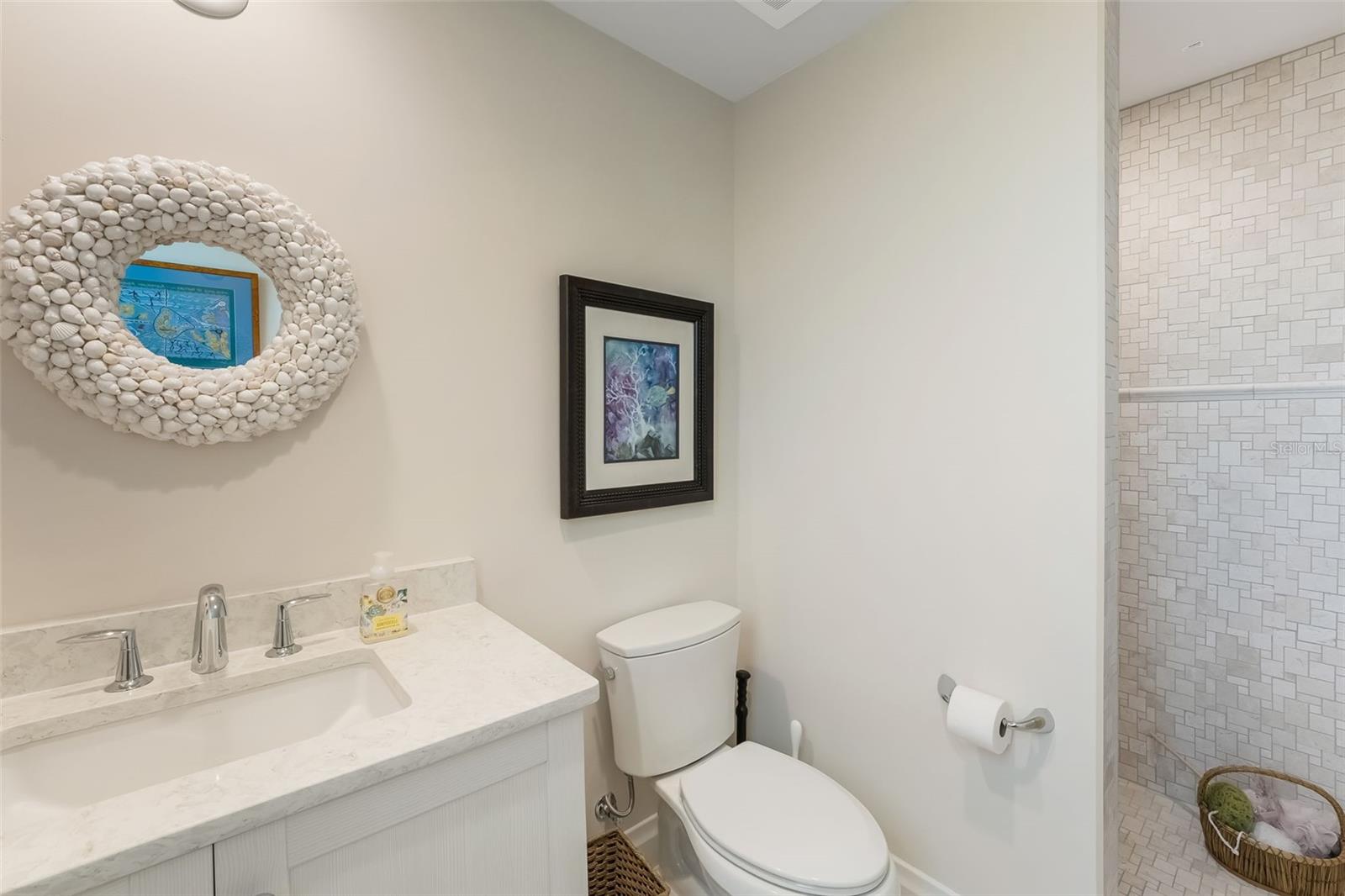 This is a full ensuite bathroom with a shower off of the 2nd guest bedroom