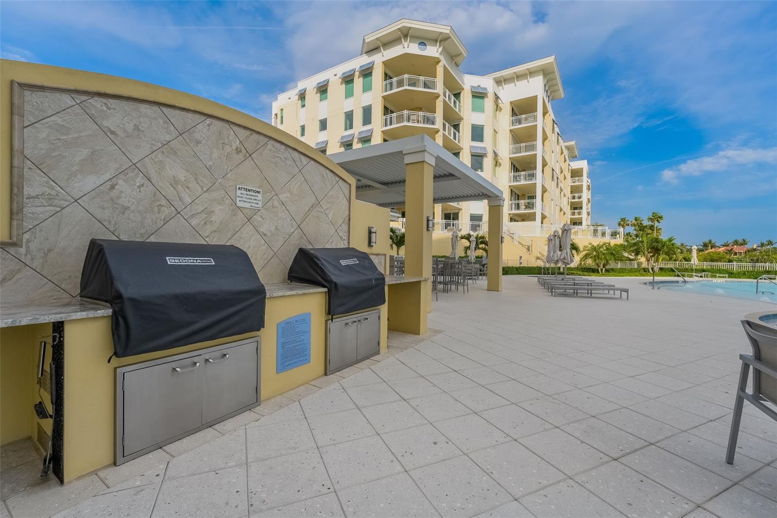 There are many grill areas but this one is located right in the pool area right next to the building.
