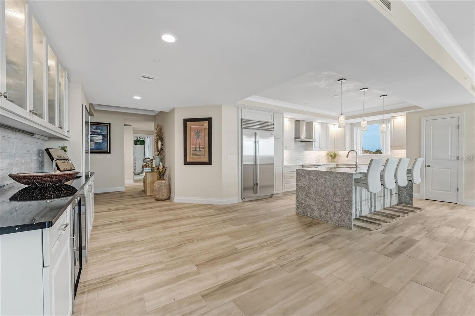 This shows the open floor plan that the condo offers.  The condo offers the same tile flooring throughout.