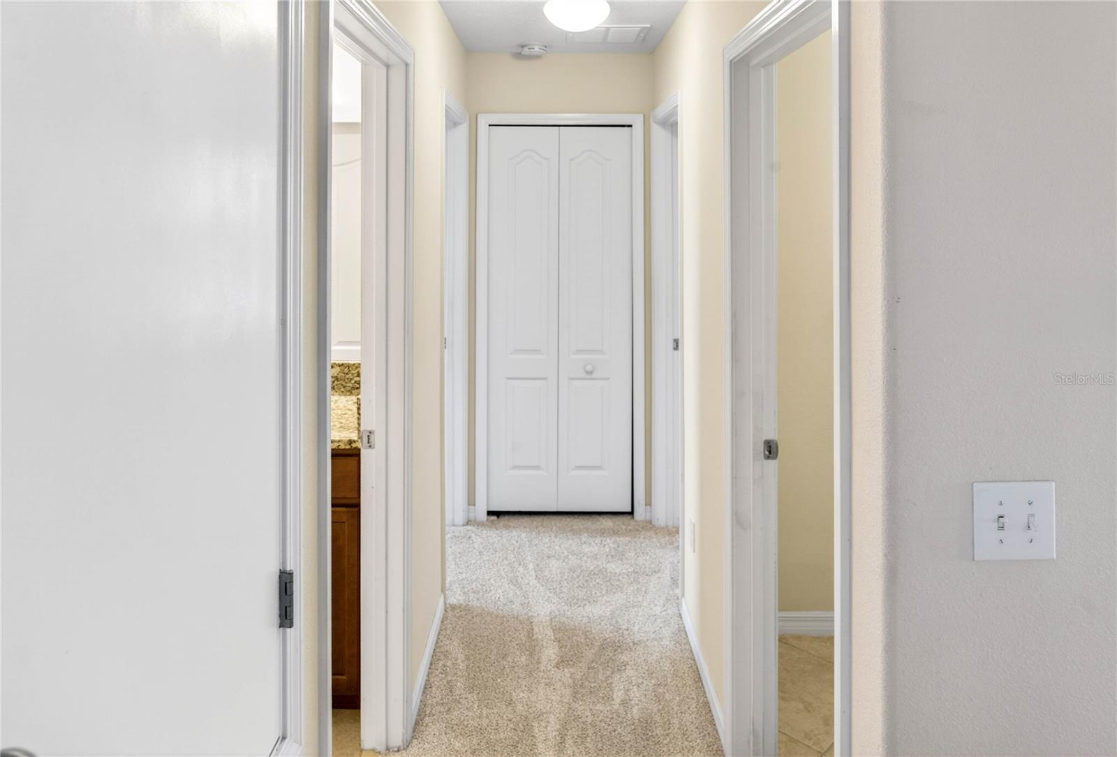 Hallway to Bedroom 3 & 4, Bath 3, and Laundry
