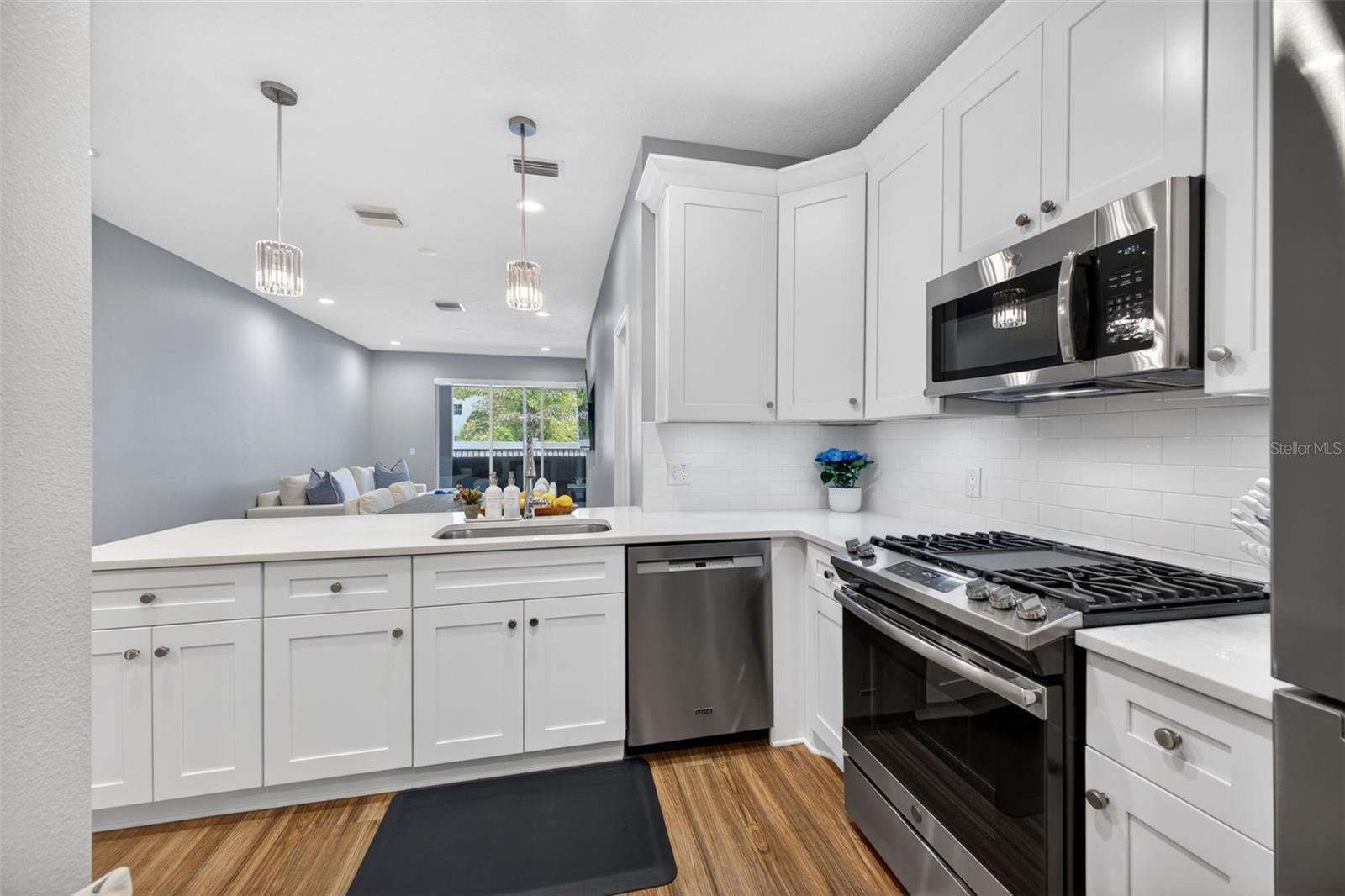 Kitchen w/Breakfast Bar Opens Up to the Living Space