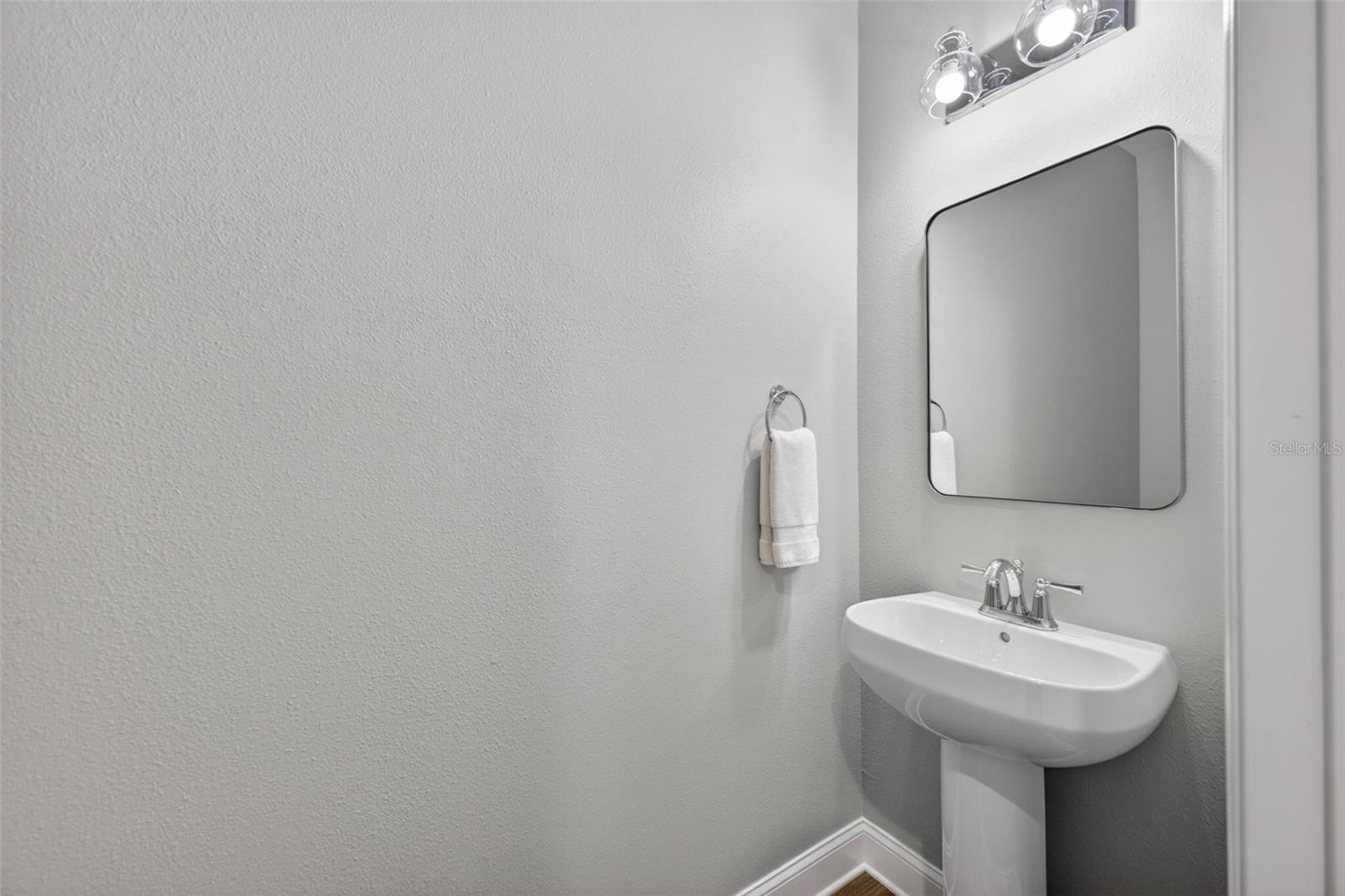 Half Bath Off The Entry Hallway